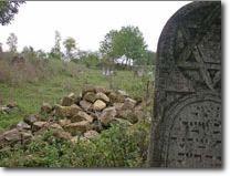Gravestone and rubble in Tovste's Jewish cemetery